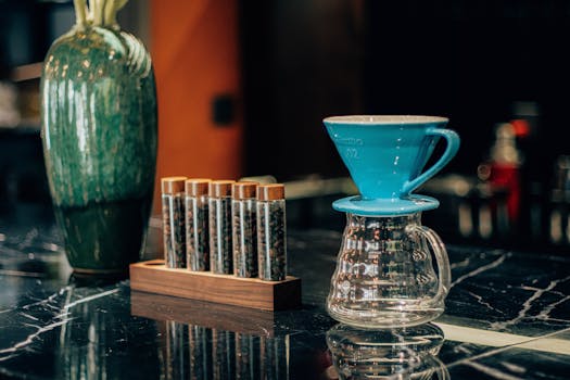Stylish coffee brewing station featuring a V60 dripper and coffee bean samples.